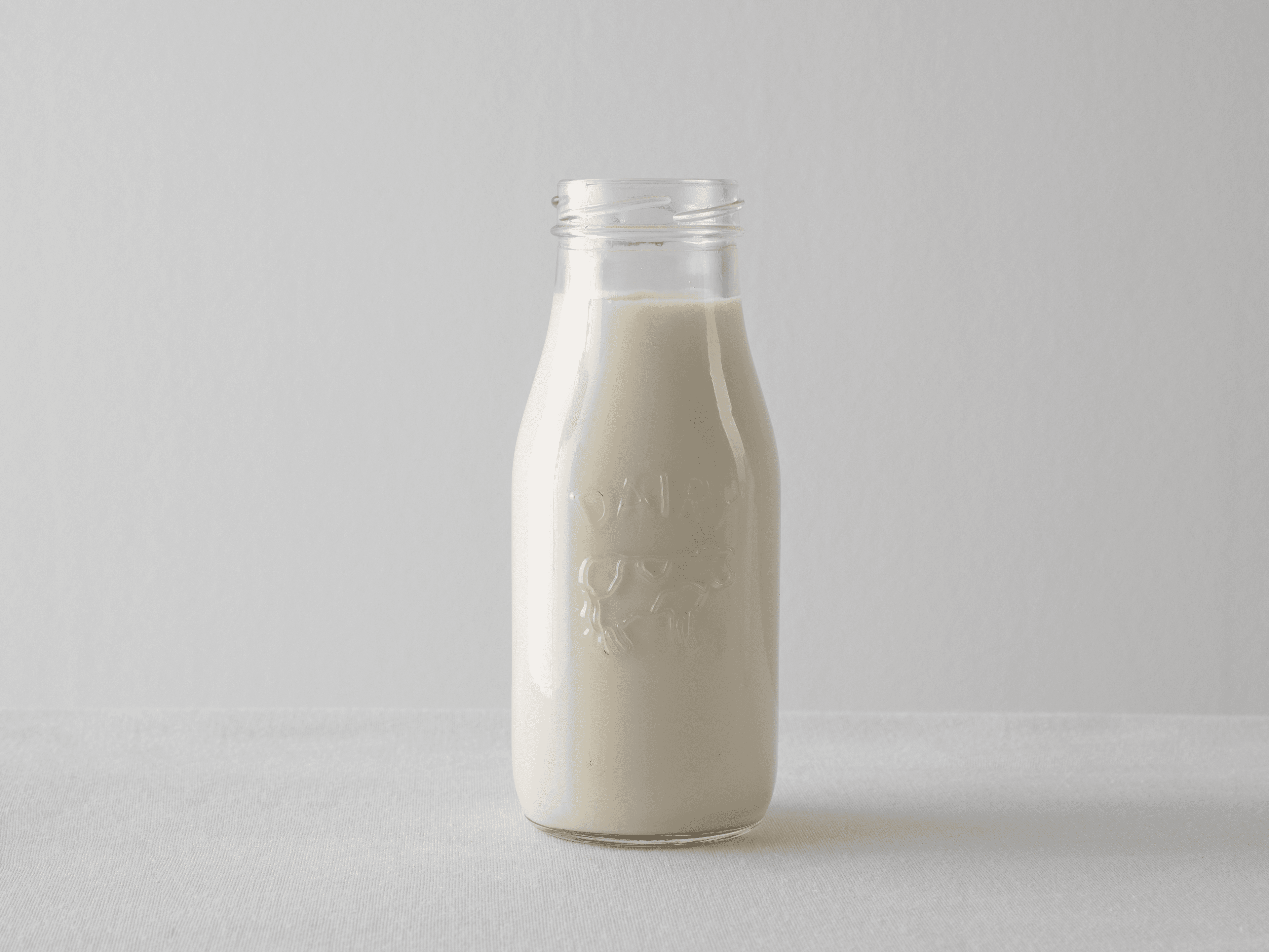 A glass bottle of cow's milk